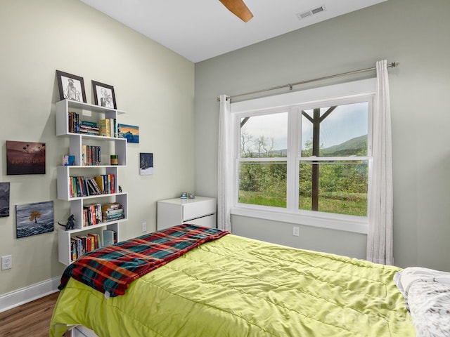 1810 Coopers Gap Rd, Mill Spring, NC 28756 - bedroom with baseboards, ceiling fan, dark wood-style floors, and visible vents
