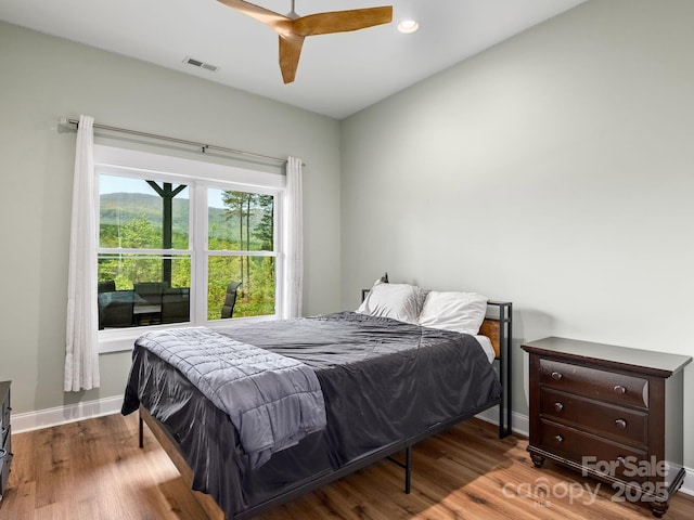 1810 Coopers Gap Rd, Mill Spring, NC 28756 - bedroom featuring baseboards, ceiling fan, wood finished floors, and visible vents