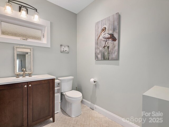 1810 Coopers Gap Rd, Mill Spring, NC 28756 - half bath featuring baseboards, vanity, and toilet