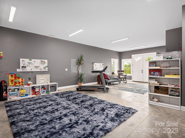 1810 Coopers Gap Rd, Mill Spring, NC 28756 - playroom with baseboards and concrete flooring