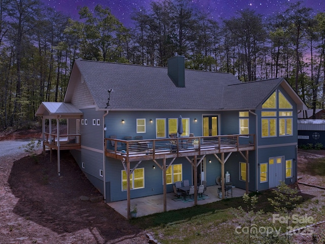 1810 Coopers Gap Rd, Mill Spring, NC 28756 - rear view of property with a shingled roof, a wooden deck, a chimney, and a patio