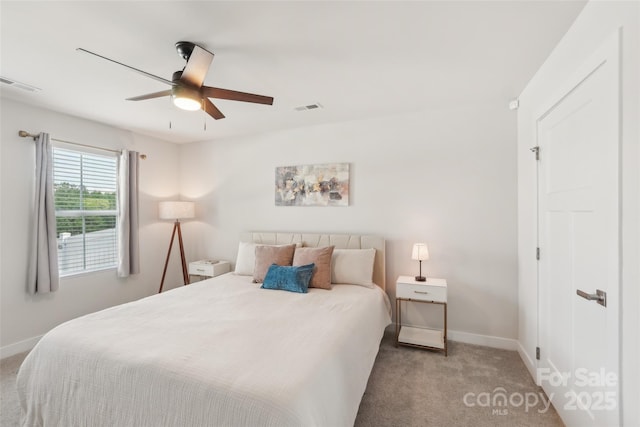 bedroom featuring baseboards, visible vents, and carpet flooring
