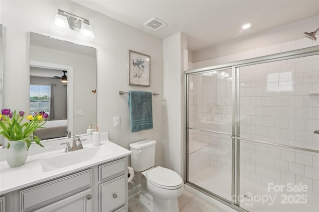 full bathroom with a shower stall, vanity, toilet, visible vents, and ensuite bathroom