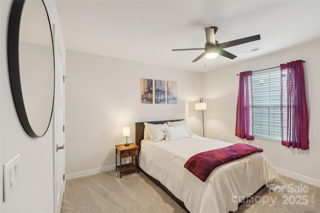 bedroom featuring multiple windows, baseboards, and carpet floors