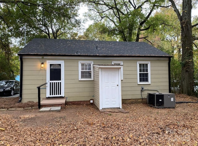 4100 Howie Cir, Charlotte, NC 28205 - rear view of house featuring central AC and roof with shingles