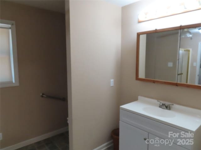 bathroom featuring vanity and baseboards