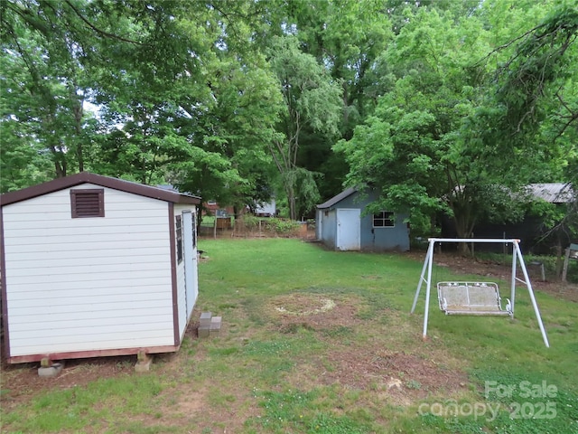 view of yard with an outdoor structure and a storage unit