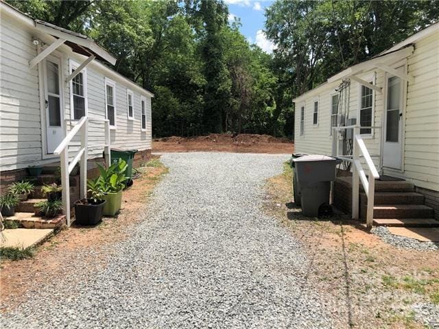 424 Skyland Ave, Charlotte, NC 28205 - view of side of home featuring gravel driveway