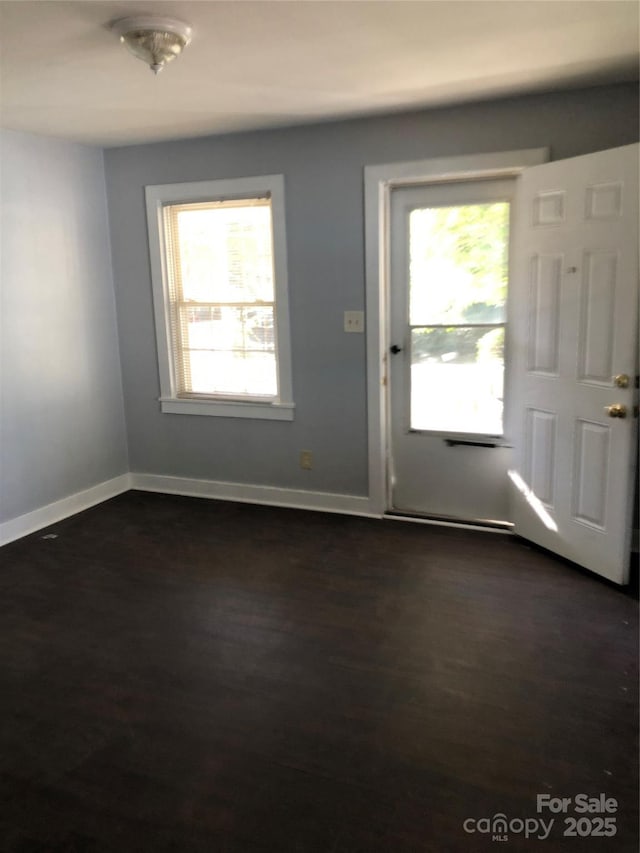 424 Skyland Ave, Charlotte, NC 28205 - doorway with baseboards, dark wood-style floors, and plenty of natural light