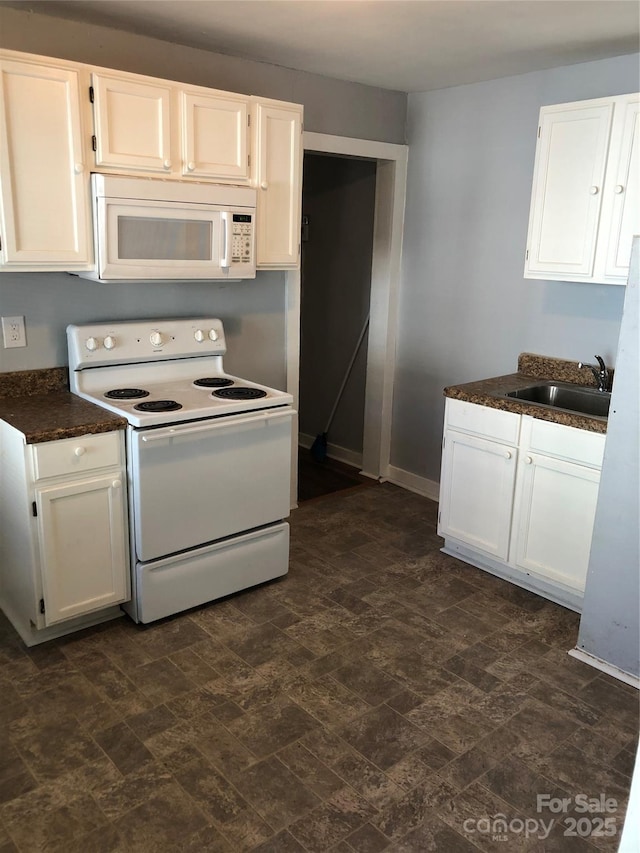 424 Skyland Ave, Charlotte, NC 28205 - kitchen with a sink, white cabinets, and white appliances