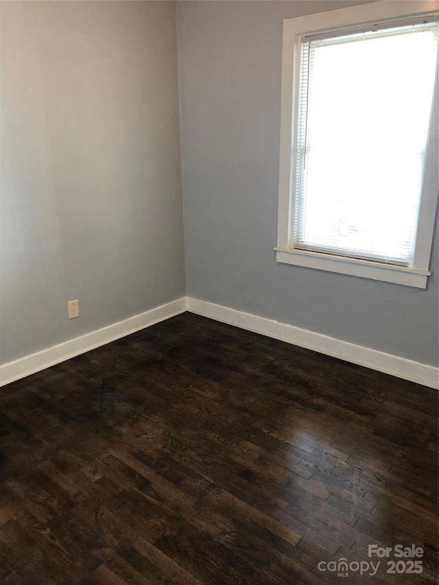 424 Skyland Ave, Charlotte, NC 28205 - spare room with dark wood-style flooring and baseboards