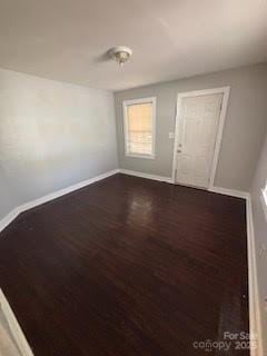424 Skyland Ave, Charlotte, NC 28205 - unfurnished room featuring baseboards and wood finished floors
