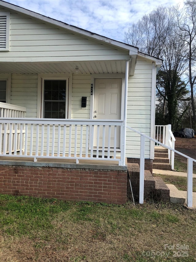 424 Skyland Ave, Charlotte, NC 28205 - doorway to property with a porch