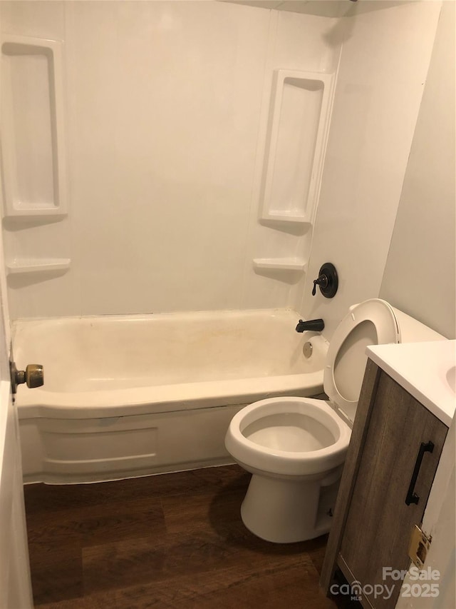 424 Skyland Ave, Charlotte, NC 28205 - full bathroom with toilet, tub / shower combination, wood finished floors, and vanity