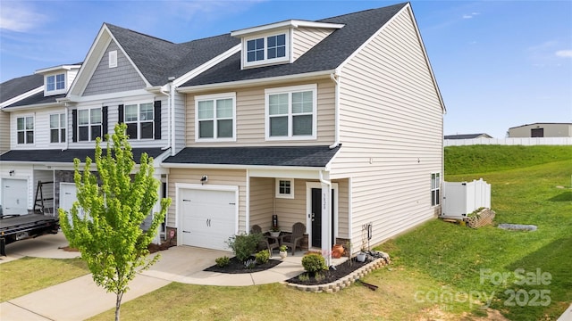 3828 Yorkshire Pl, Terrell, NC 28682 - view of front of house with a front lawn, driveway, fence, a garage, and a shingled roof