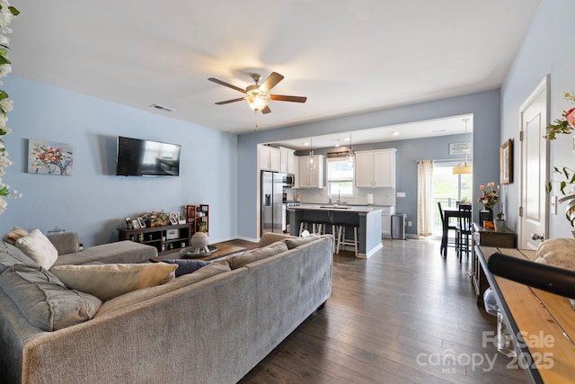 3828 Yorkshire Pl, Terrell, NC 28682 - living area featuring a ceiling fan, visible vents, and dark wood finished floors