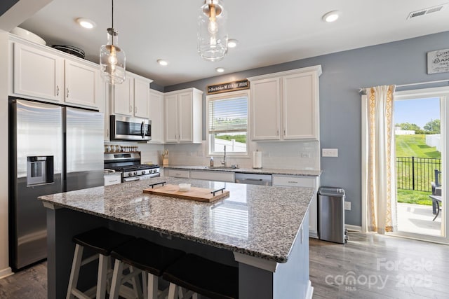 3828 Yorkshire Pl, Terrell, NC 28682 - kitchen with backsplash, stainless steel appliances, visible vents, and white cabinets