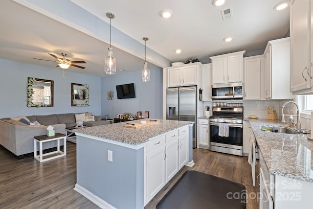 3828 Yorkshire Pl, Terrell, NC 28682 - kitchen with white cabinets, appliances with stainless steel finishes, a sink, and visible vents