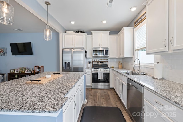 3828 Yorkshire Pl, Terrell, NC 28682 - kitchen featuring a sink, stainless steel appliances, white cabinets, light stone countertops, and dark wood-style floors