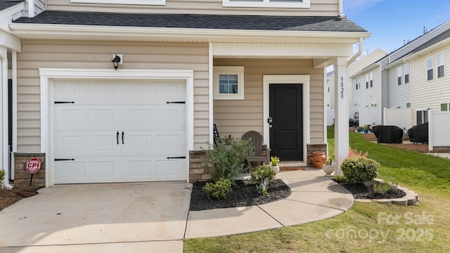 3828 Yorkshire Pl, Terrell, NC 28682 - property entrance featuring concrete driveway, a shingled roof, and a lawn