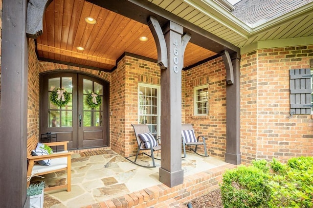 4600 Spicewood Dr, Charlotte, NC 28227 - property entrance featuring brick siding, french doors, and roof with shingles
