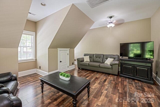 4600 Spicewood Dr, Charlotte, NC 28227 - living area with lofted ceiling, dark wood-style flooring, visible vents, and baseboards