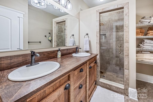 4600 Spicewood Dr, Charlotte, NC 28227 - bathroom with double vanity, a spacious closet, a stall shower, and a sink