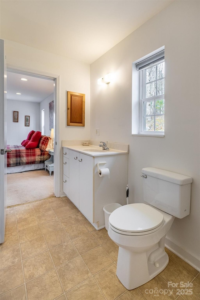 661 Old Chestnut Mountain Rd, Newland, NC 28657 - bathroom with toilet, vanity, and baseboards