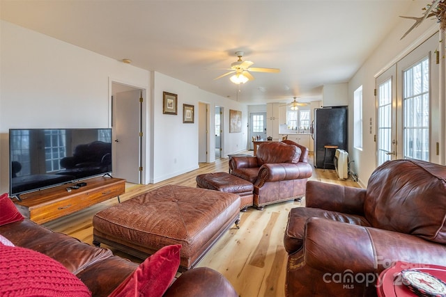 661 Old Chestnut Mountain Rd, Newland, NC 28657 - living area featuring a ceiling fan, light wood-style floors, and healthy amount of natural light