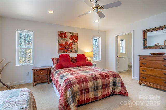 661 Old Chestnut Mountain Rd, Newland, NC 28657 - bedroom with light colored carpet, multiple windows, baseboards, recessed lighting, and ensuite bath