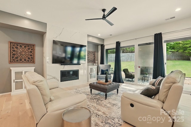 9305 Valley Rd, Charlotte, NC 28270 - living area with recessed lighting, light wood-style floors, a high end fireplace, ceiling fan, and visible vents