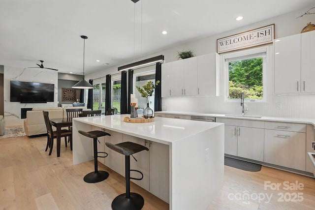 9305 Valley Rd, Charlotte, NC 28270 - kitchen featuring plenty of natural light, light wood finished floors, and a sink