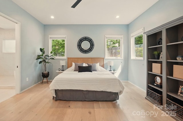 9305 Valley Rd, Charlotte, NC 28270 - bedroom with multiple windows, wood finished floors, and baseboards