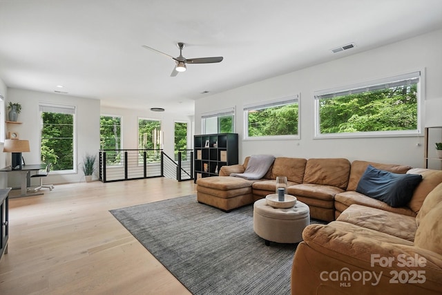 9305 Valley Rd, Charlotte, NC 28270 - living area featuring a ceiling fan, visible vents, and light wood-style floors