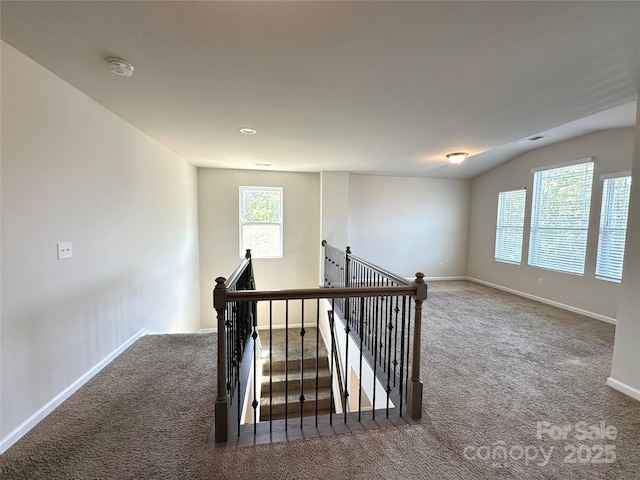 17121 Carolina Pine Row, Charlotte, NC 28278 - staircase featuring vaulted ceiling, carpet, and baseboards