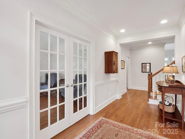 7716 Seton House Ln, Charlotte, NC 28277 - hall with french doors, stairway, light wood-type flooring, crown molding, and recessed lighting