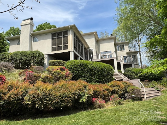 255 Charlotte Ann Ln, Hickory, NC 28601 - rear view of property with stucco siding and a chimney
