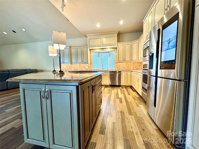 255 Charlotte Ann Ln, Hickory, NC 28601 - kitchen featuring cream cabinetry, open floor plan, light wood-style flooring, and stainless steel appliances