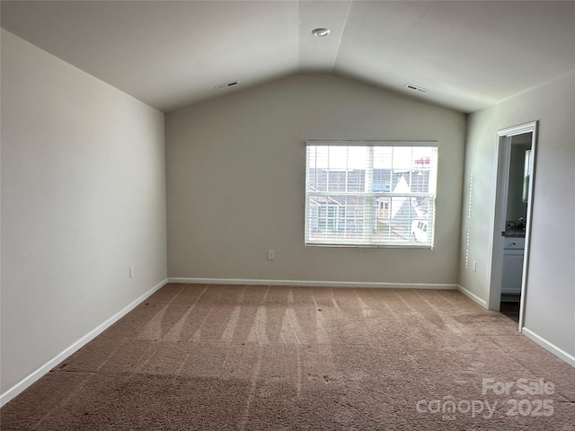 1345 Nia Rd, Charlotte, NC 28215 - empty room featuring vaulted ceiling, carpet, visible vents, and baseboards
