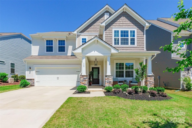 115 Haddonsfield Dr, Mooresville, NC 28115 - craftsman-style home with a garage, a front lawn, covered porch, stone siding, and driveway