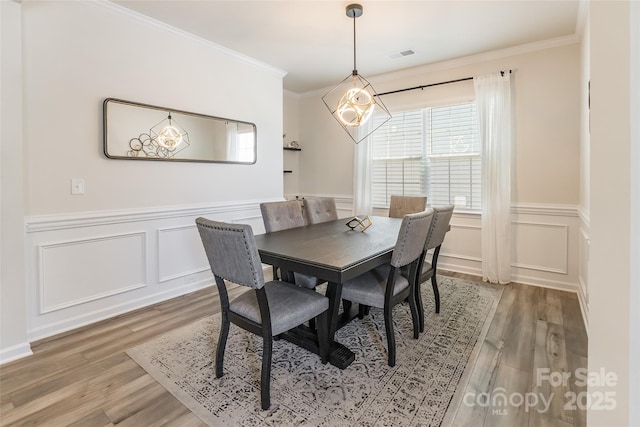 115 Haddonsfield Dr, Mooresville, NC 28115 - dining area featuring a notable chandelier, plenty of natural light, and light wood-style flooring
