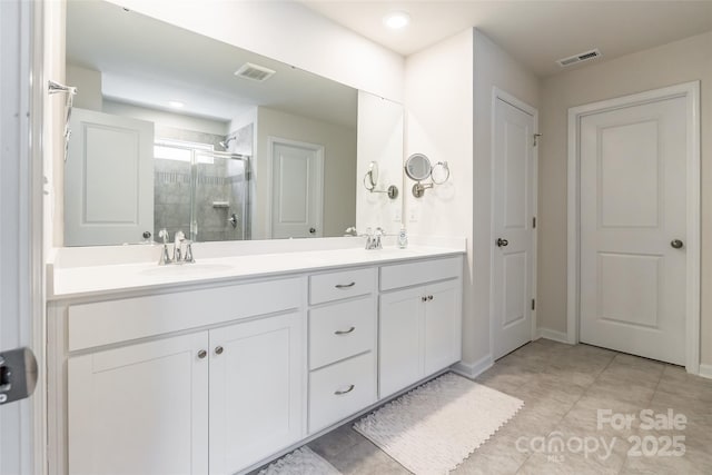 115 Haddonsfield Dr, Mooresville, NC 28115 - full bathroom featuring visible vents, a sink, a stall shower, and double vanity