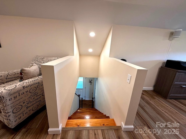 stairs featuring recessed lighting, baseboards, and wood finished floors