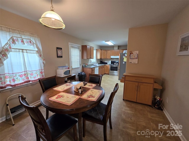 615 Tremont St, Troy, NC 27371 - dining space with baseboards