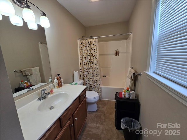 615 Tremont St, Troy, NC 27371 - bathroom featuring toilet, vanity, and shower / bath combination with curtain
