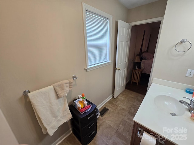 615 Tremont St, Troy, NC 27371 - bathroom with baseboards and vanity
