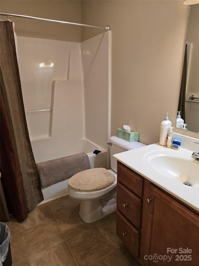 615 Tremont St, Troy, NC 27371 - bathroom with shower / bath combo, toilet, vanity, and tile patterned floors