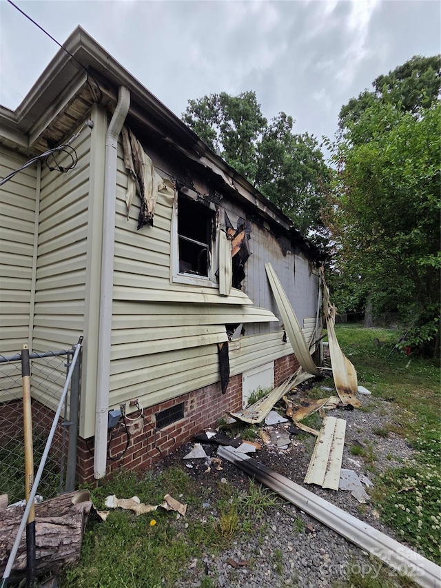 view of home's exterior with crawl space
