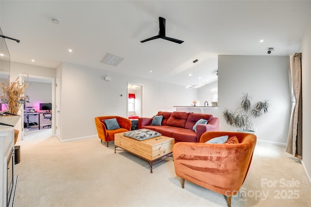 living room with light colored carpet, recessed lighting, baseboards, and lofted ceiling