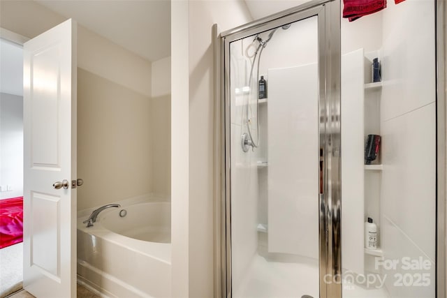 full bath featuring a shower stall and a bath